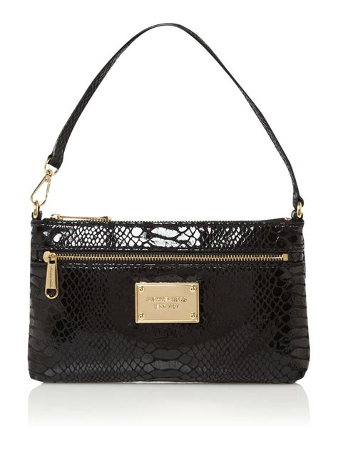 michael kors black snake clutch|Michael Kors black wristlets.